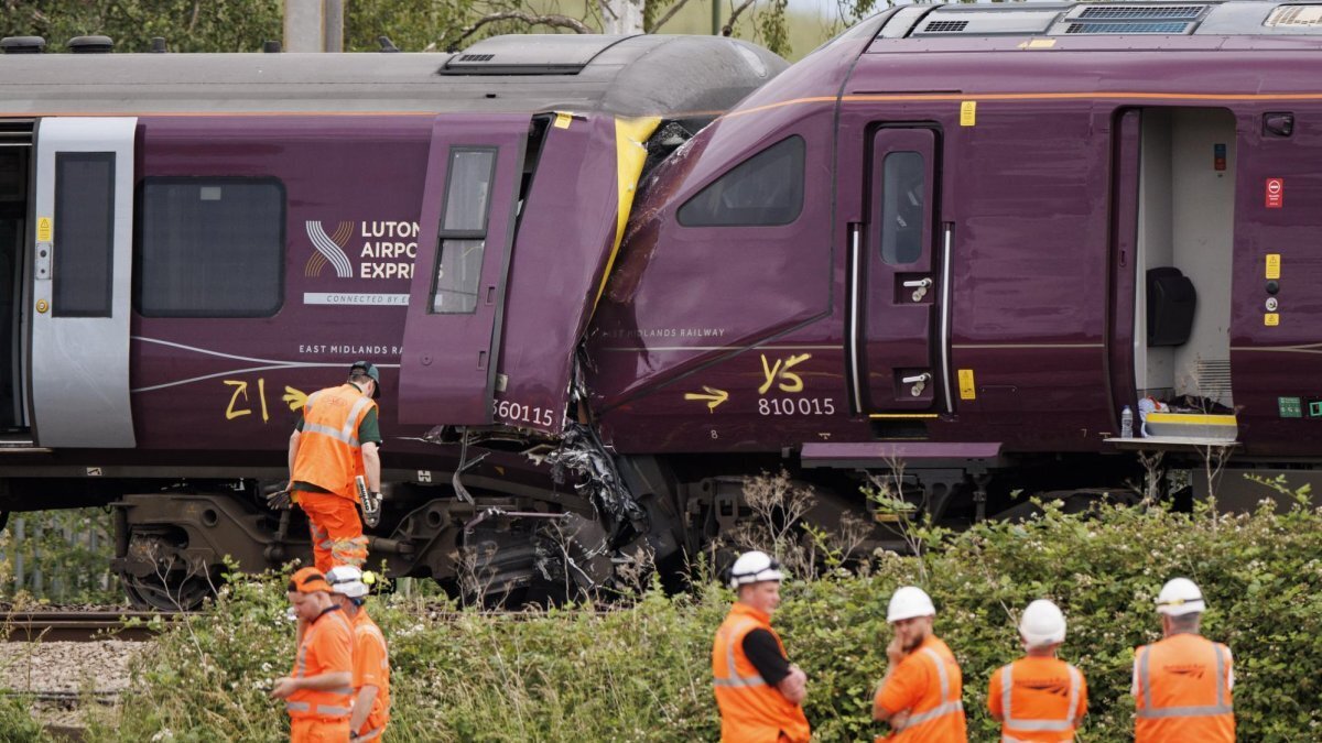 Investigators and police officers work at the scene where two East Midlands Railway trains collided near Bedford, Britain, Friday. A train driver has died and at least 80 people have been injured in the crash. According to the ambulance service 33 of the injured are in a serious condition. Nine are still critical as of Saturday morning. Photo by Tolga Akmen/EPA