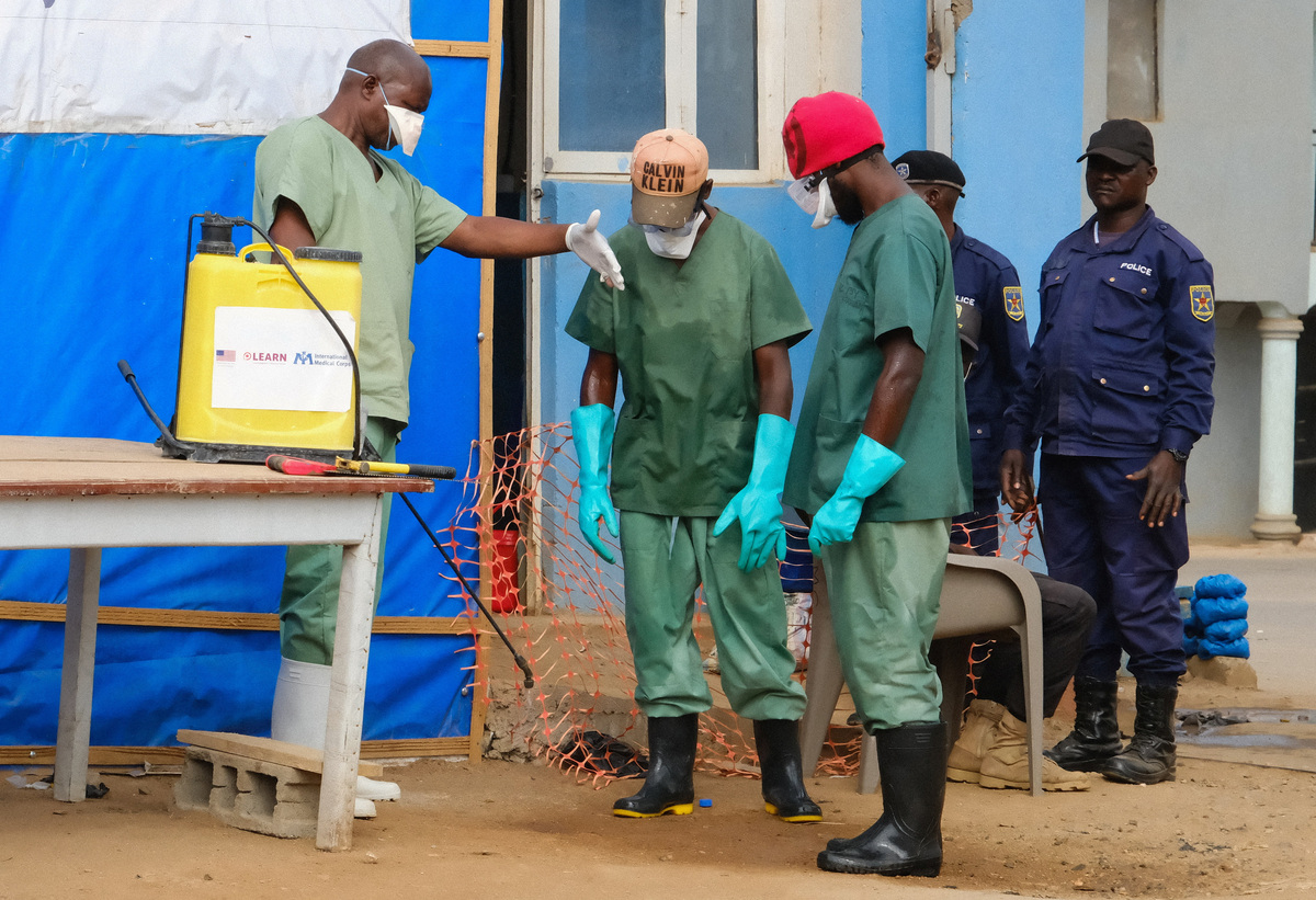 Hygiene teams disinfect the entrance to the Bunia General Reference Hospital before entry, one month after cases were confirmed in Bunia, eastern Democratic Republic of Congo, June 15, 2026. REUTERS/Gradel Muyisa Mumbere