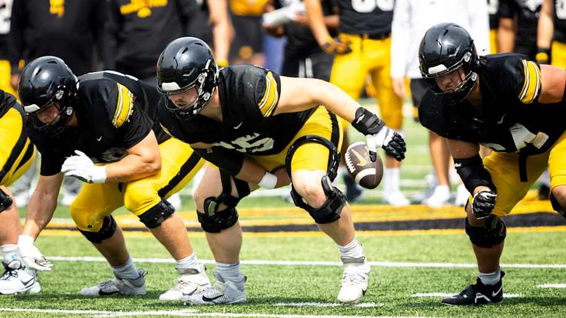 Aug 9, 2025; Iowa offensive lineman Logan Jones (65) snaps the ball during the Hawkeyes Kids Day NCAA football open practice at Kinnick Stadium in Iowa City, Iowa. Mandatory Credit: Joseph Cress for the Des Moines Register | Joseph Cress/For the Register / USA TODAY NETWORK via Imagn Images 