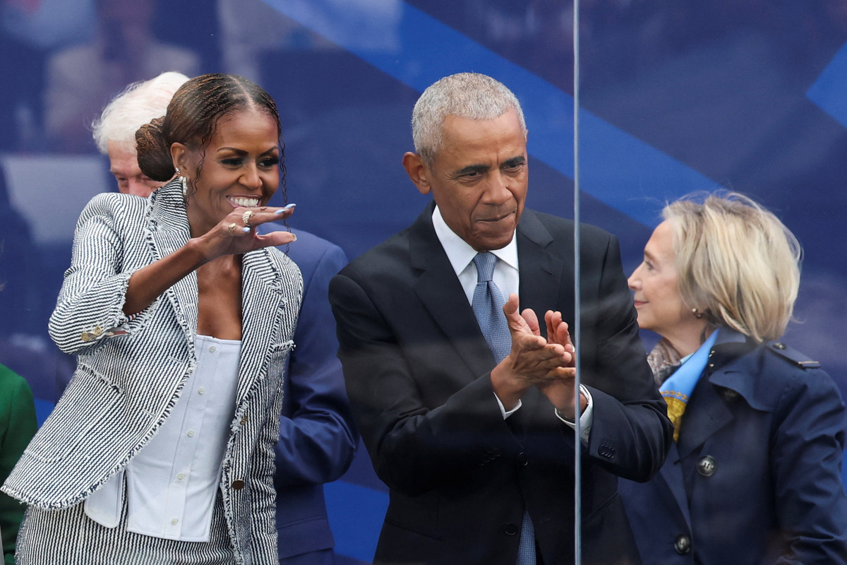 Former U.S. President Barack Obama and Michelle Obama attend a dedication ceremony for the opening of the Obama Presidential Center, in Chicago, Illinois, U.S., June 18, 2026. REUTERS/Brendan McDermid