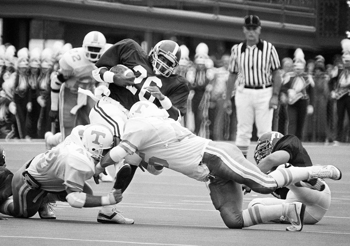  Alabama running back Bobby Humphrey gets grabbed by two Tennessee defenders. Imagn Images