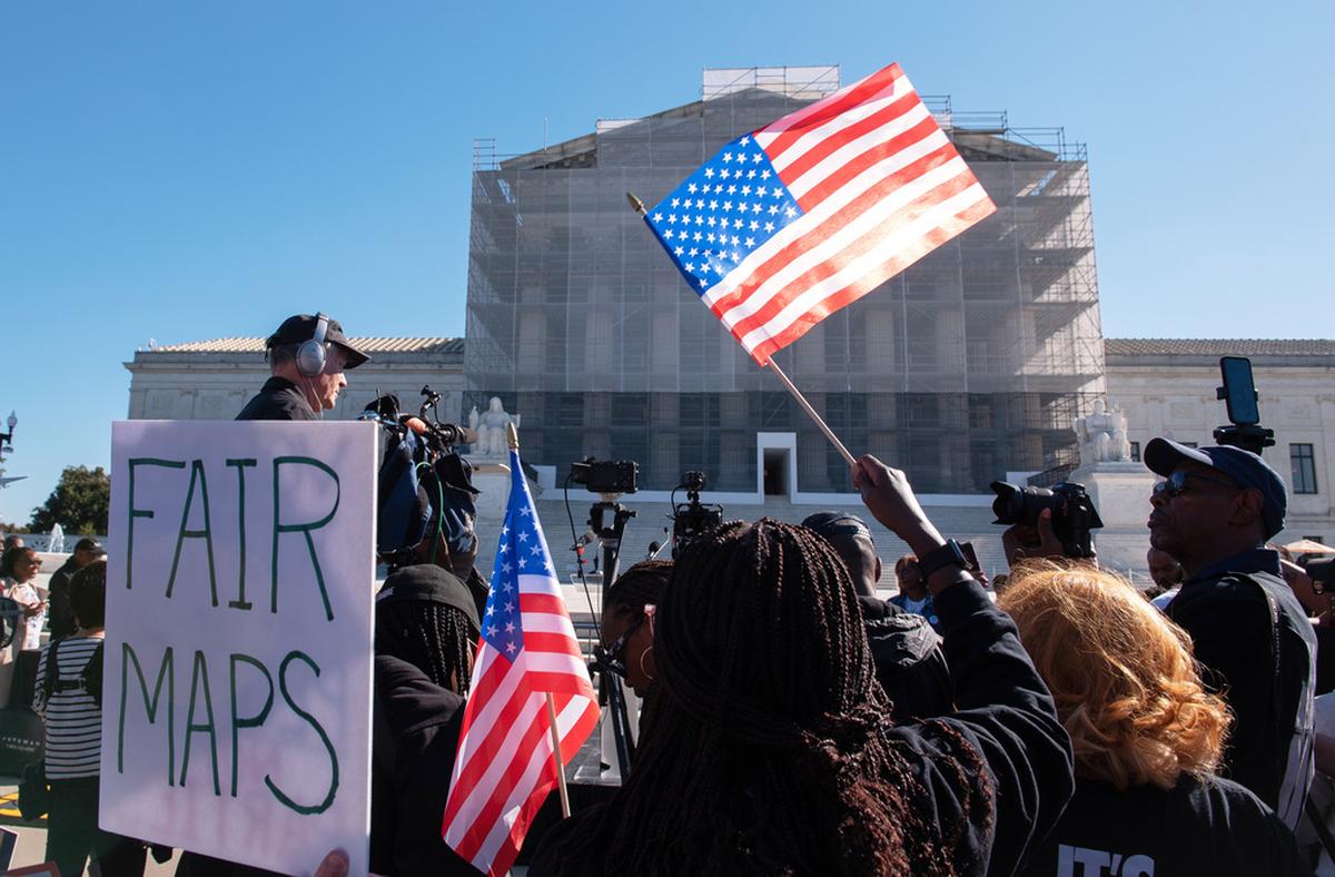 Voting rights activists gather outside the Supreme Court in Washington, D.C., on October 15, 2025. 