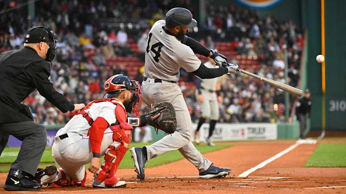 New York Yankees third baseman Amed Rosario (14) hits a three run home run against the Boston Red Sox in the first inning at Fenway Park | Eric Canha-Imagn Images 