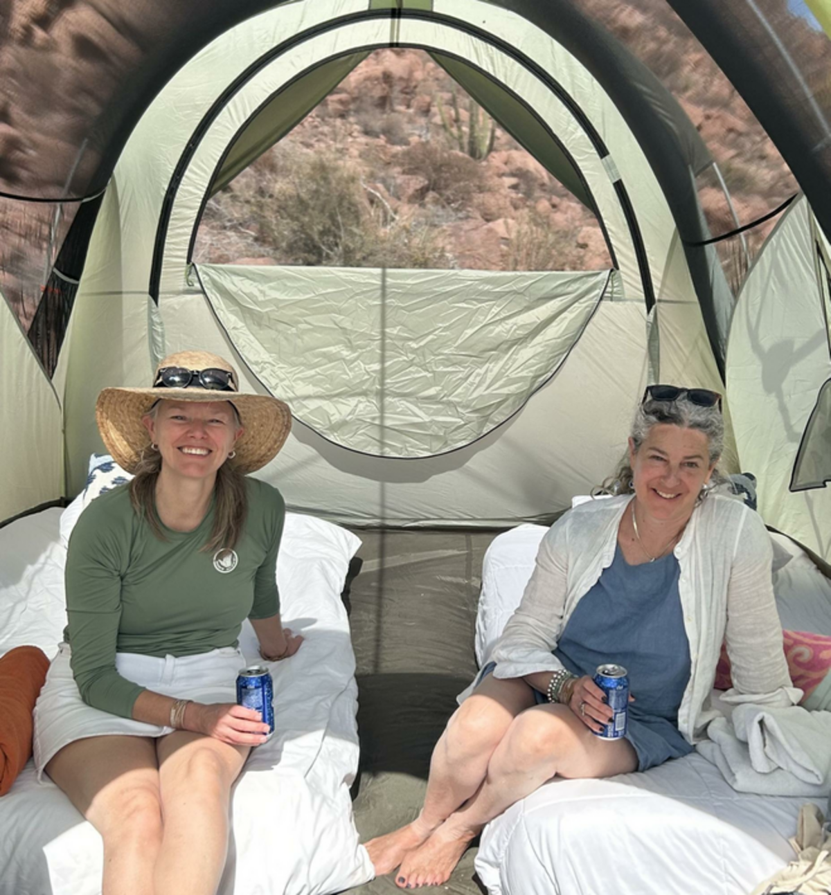 Friends relax in their tent at Camp Cecil de la Isla. Photo Credit: Jennifer Merrick
