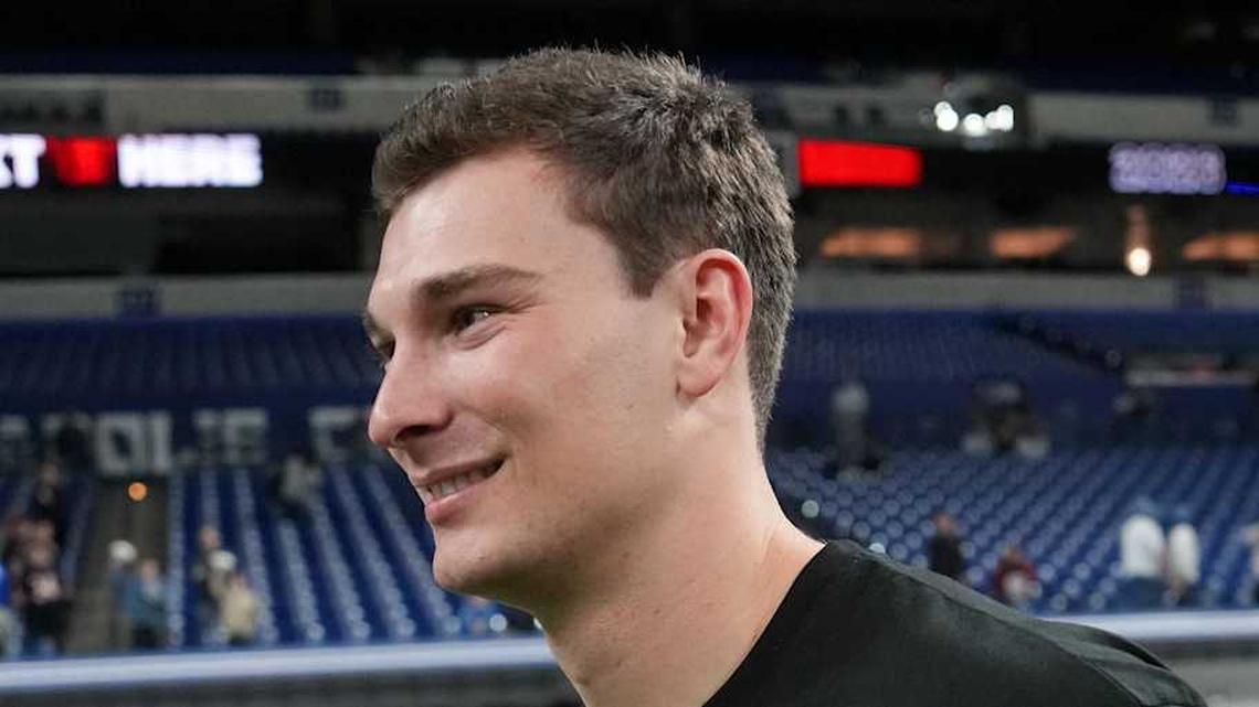  Feb 28, 2026; Indianapolis, IN, USA; Indiana quarterback Fernando Mendoza (QB11) looks on during the NFL Scouting Combine at Lucas Oil Stadium. Mandatory Credit: Kirby Lee-Imagn Images | Kirby Lee-Imagn Images 