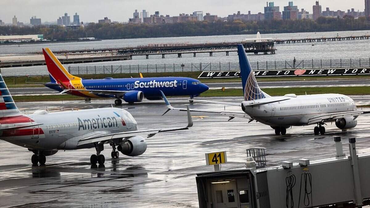 Planes line up on the tarmac at LaGuardia Airport on Monday, Nov. 10, 2025, in New York City. FAA-ordered delays and flight cancellations to ease the pressure on air traffic controllers increased on Tuesday.