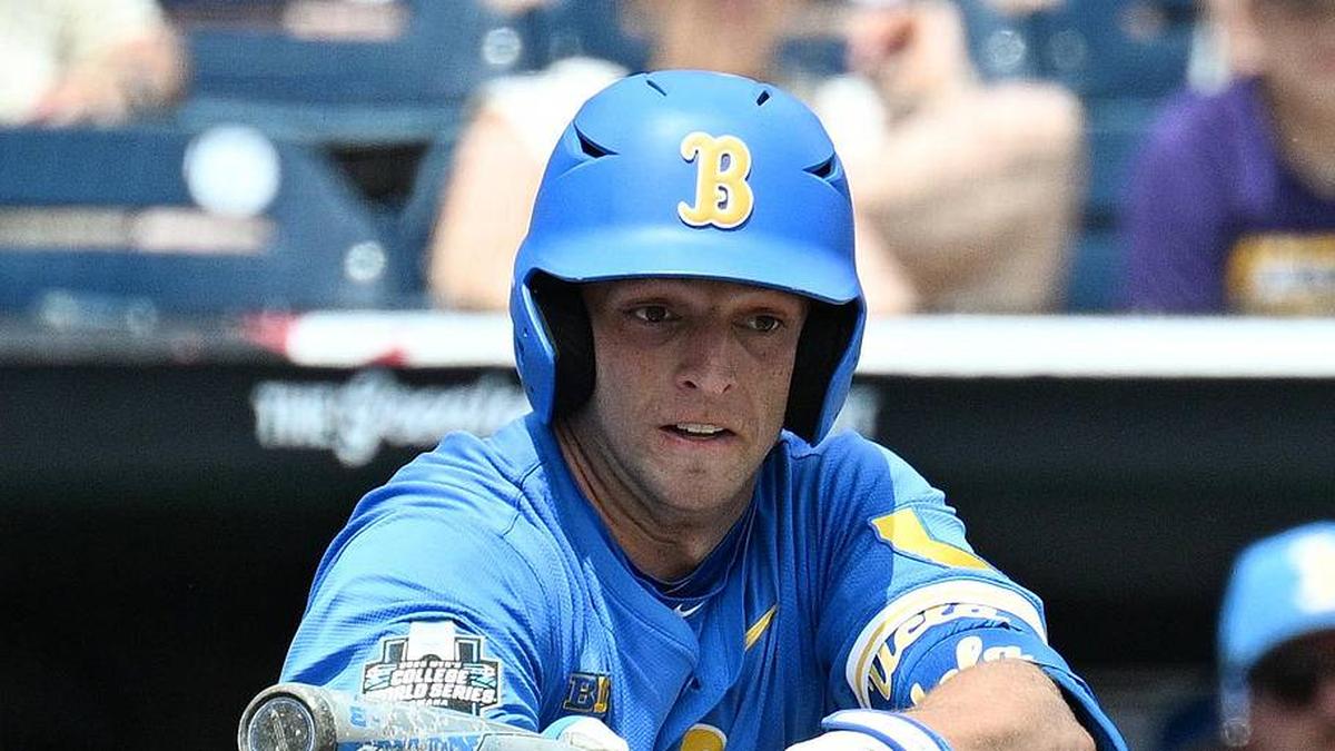  Jun 14, 2025; Omaha, Neb, USA; UCLA Bruins shortstop Roch Cholowsky (1) bunts in a run against the Murray State Racers during the fourth inning at Charles Schwab Field. Mandatory Credit: Steven Branscombe-Imagn Images | Steven Branscombe-Imagn Images 