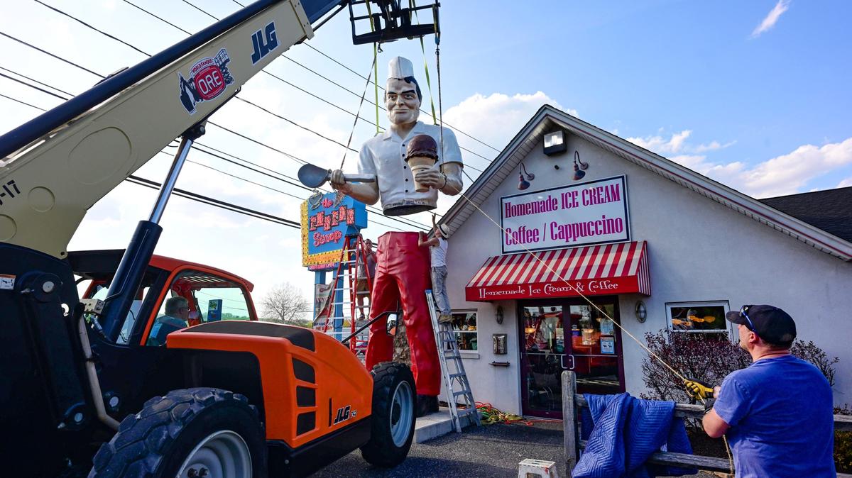 Roadside artist Mark Cline pieces the Giant Chip statue back together Thursday, April 16, 2026, at Inside Scoop in Coopersburg. The popular, 25-foot-high statue was toppled by high winds in February. Cline, who built the statue, was on site Thursday to repair it. (Monica Cabrera / The Morning Call)
