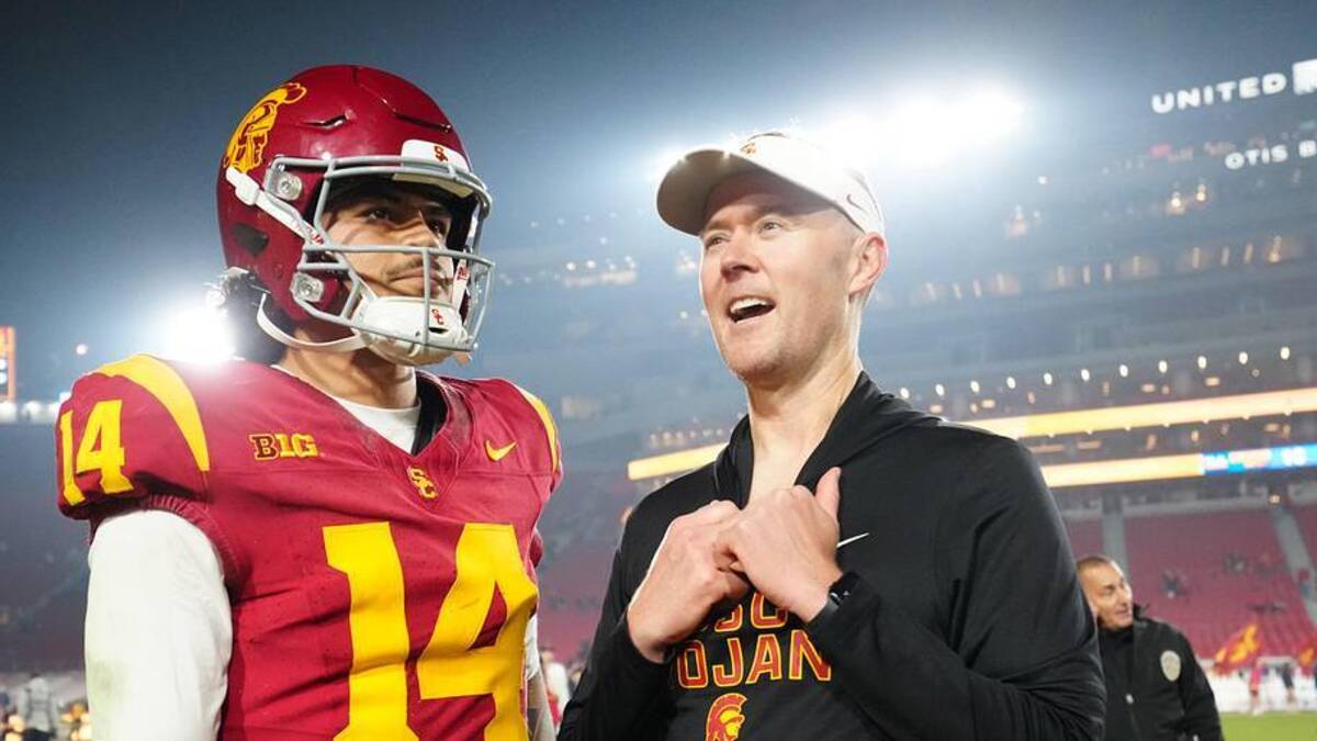  Nov 29, 2025; Los Angeles, California, USA; Southern California Trojans quarterback Jayden Maiava (14) and head coach Lincoln Riley react after the game against the UCLA Bruins at United Airlines Field at Los Angeles Memorial Coliseum. Mandatory Credit: Kirby Lee-Imagn Images | Kirby Lee-Imagn Images 