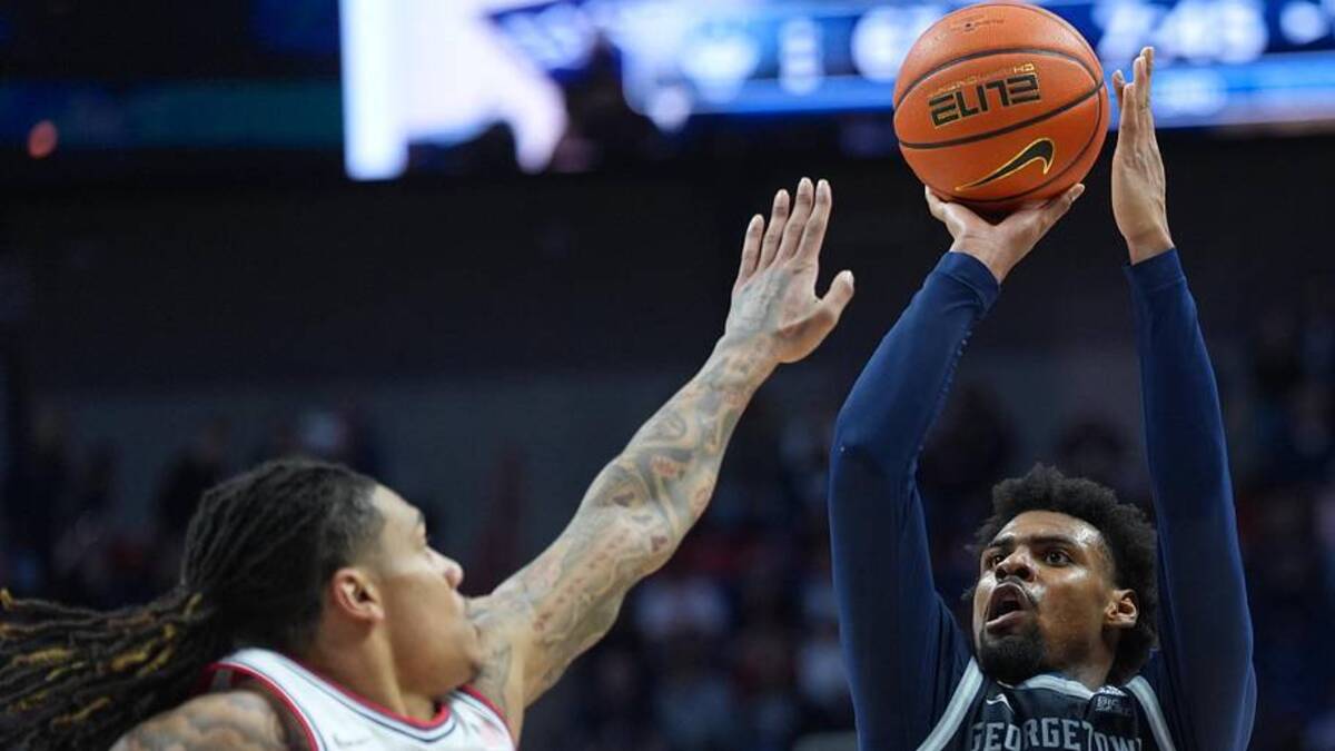 Feb 14, 2026; Storrs, Connecticut, USA; Georgetown Hoyas guard KJ Lewis (5) shoots the ball against UConn Huskies guard Solo Ball (1) in the second half at Harry A. Gampel Pavilion. Mandatory Credit: David Butler II-Imagn Images | David Butler II-Imagn Images 