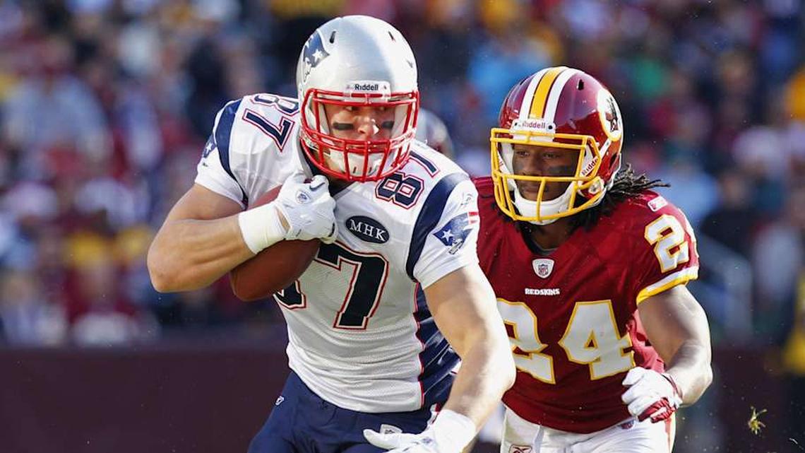  Dec 11, 2011; Landover, MD, USA; New England Patriots tight end Rob Gronkowski (87) runs with the ball past Washington Redskins strong safety DeJon Gomes (24) in the first quarter at FedEx Field. Mandatory Credit: Geoff Burke-Imagn Images | Geoff Burke-Imagn Images 