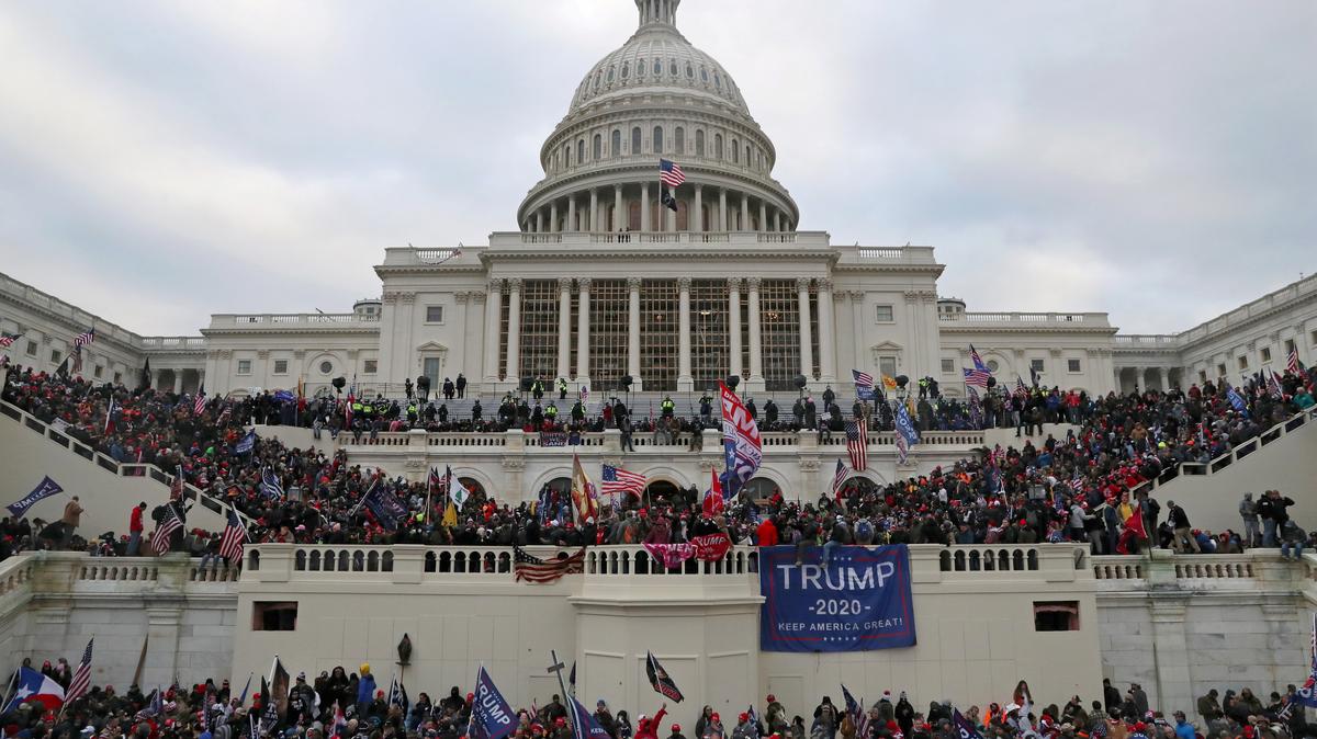 FILE PHOTO: A mob of supporters of U.S. President Donald Trump storm the U.S. Capitol Building in Washington, U.S., January 6, 2021. Picture taken January 6, 2021. REUTERS/Leah Millis/File Photo