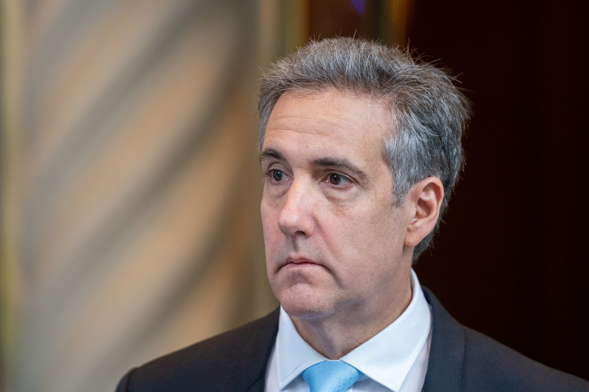  Michael Cohen departs from his home to attend his second day of testimony at Manhattan Criminal Court on May 14, 2024 in New York City. 