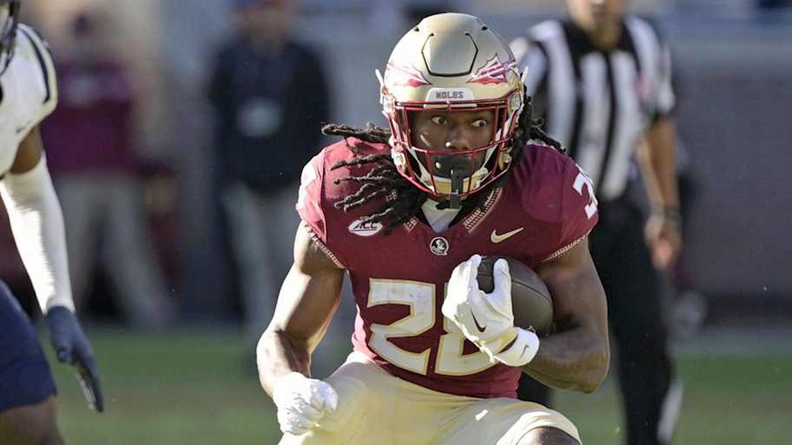  Nov 23, 2024; Tallahassee, Florida, USA; Florida State Seminoles running back Samuel Singleton Jr. (28) runs the ball against the Charleston Southern Buccaneers during the second half at Doak S. Campbell Stadium. Mandatory Credit: Melina Myers-Imagn Images | Melina Myers-Imagn Images 