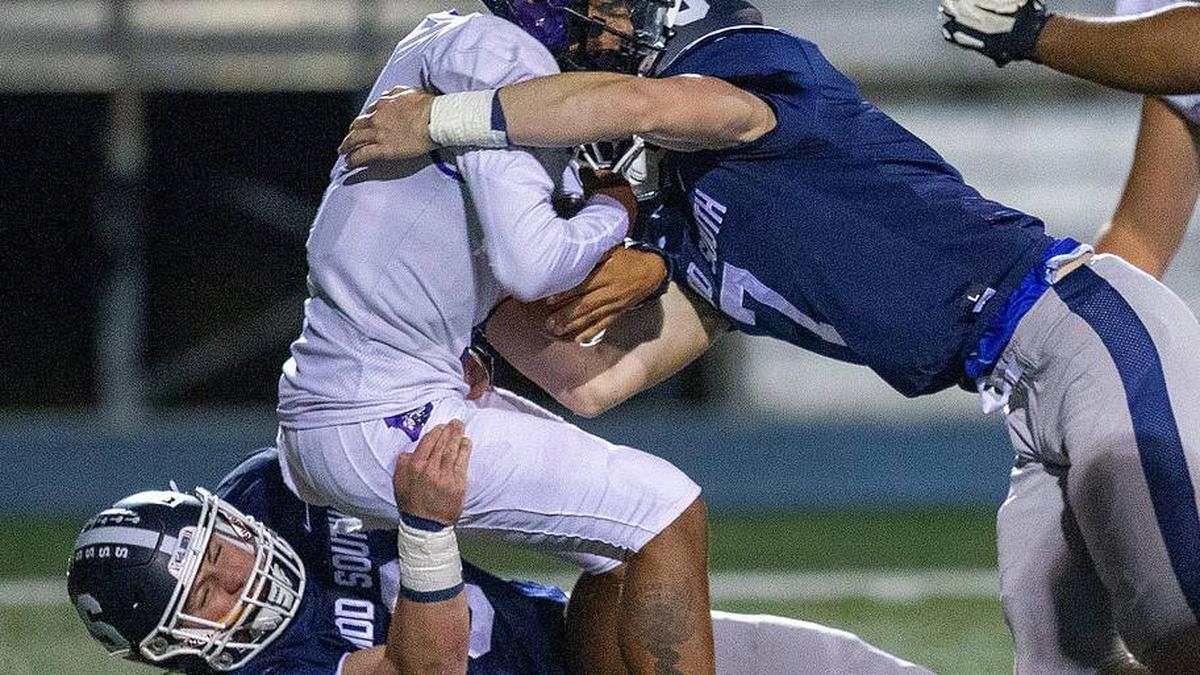  Cherry Hill West's Jordon DeJesus Gonzalez is sacked by Middletown South's Colin Gallagher and Luke Wafle during the first half of the Cherry Hill West vs. Middletown South NJSIAA Central Group 4 playoff football game at Middletown High School South in Middletown, NJ Friday, October 28, 2022. Mid03 | Tanya Breen / USA TODAY NETWORK 