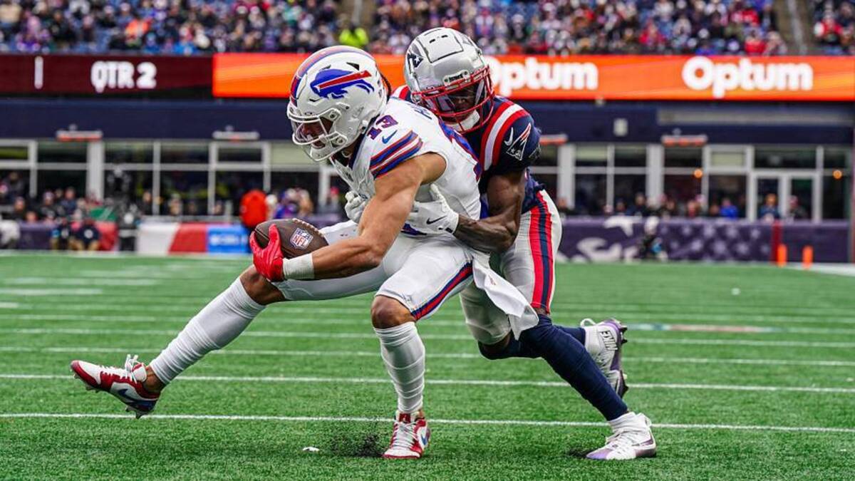  Jan 5, 2025; Foxborough, Massachusetts, USA; New England Patriots cornerback Marcellas Dial Jr. (27) stops Buffalo Bills wide receiver Mack Hollins (13) near the end zone in the fist half at Gillette Stadium. Mandatory Credit: David Butler II-Imagn Images | David Butler II-Imagn Images 