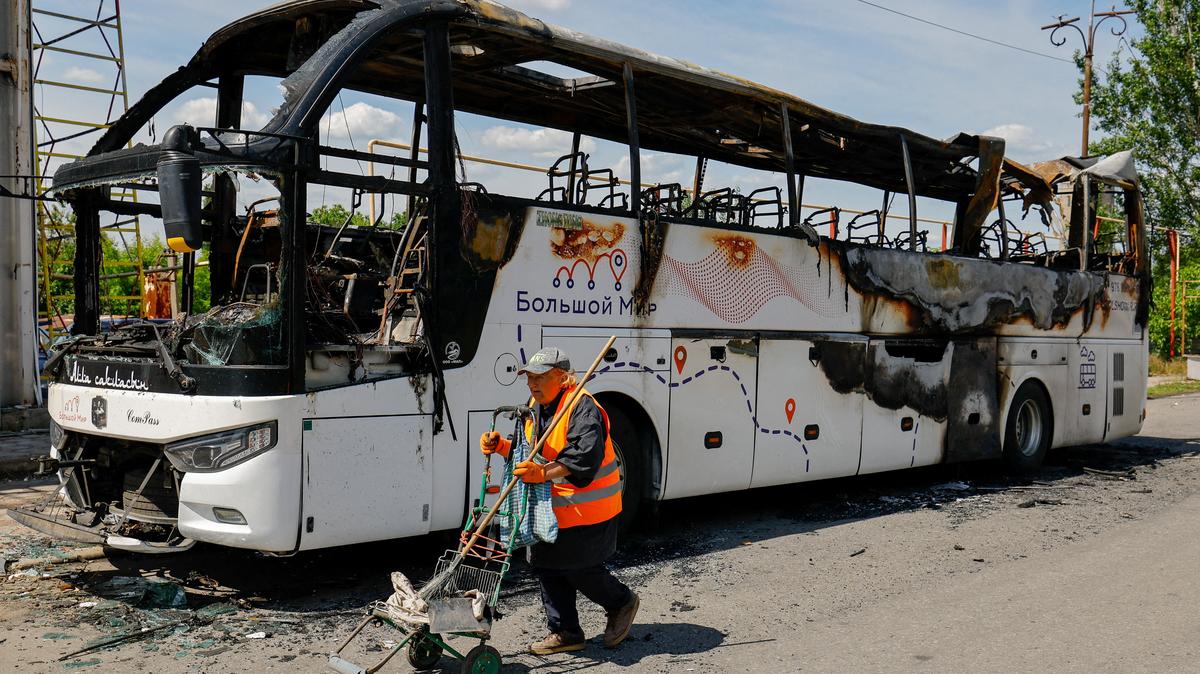 A worker walks at the site of a Ukrainian drone attack on a bus, according to local authorities in the course of the Russia-Ukraine military conflict, in the settlement of Yenakiievo in Donetsk region, a Russian-controlled part of Ukraine, June 3, 2026.  REUTERS/Alexander Ermochenko