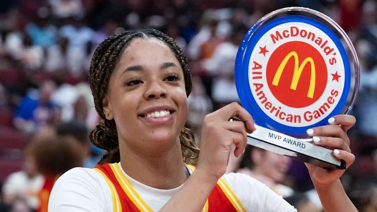  Mar 31, 2026; Glendale, AZ, USA; Saniyah Hall (2) celebrates with the player of the game trophy during the McDonalds All American Girls Game at Desert Diamond Arena. Mandatory Credit: Mark J. Rebilas-Imagn Images | Mark J. Rebilas-Imagn Images 