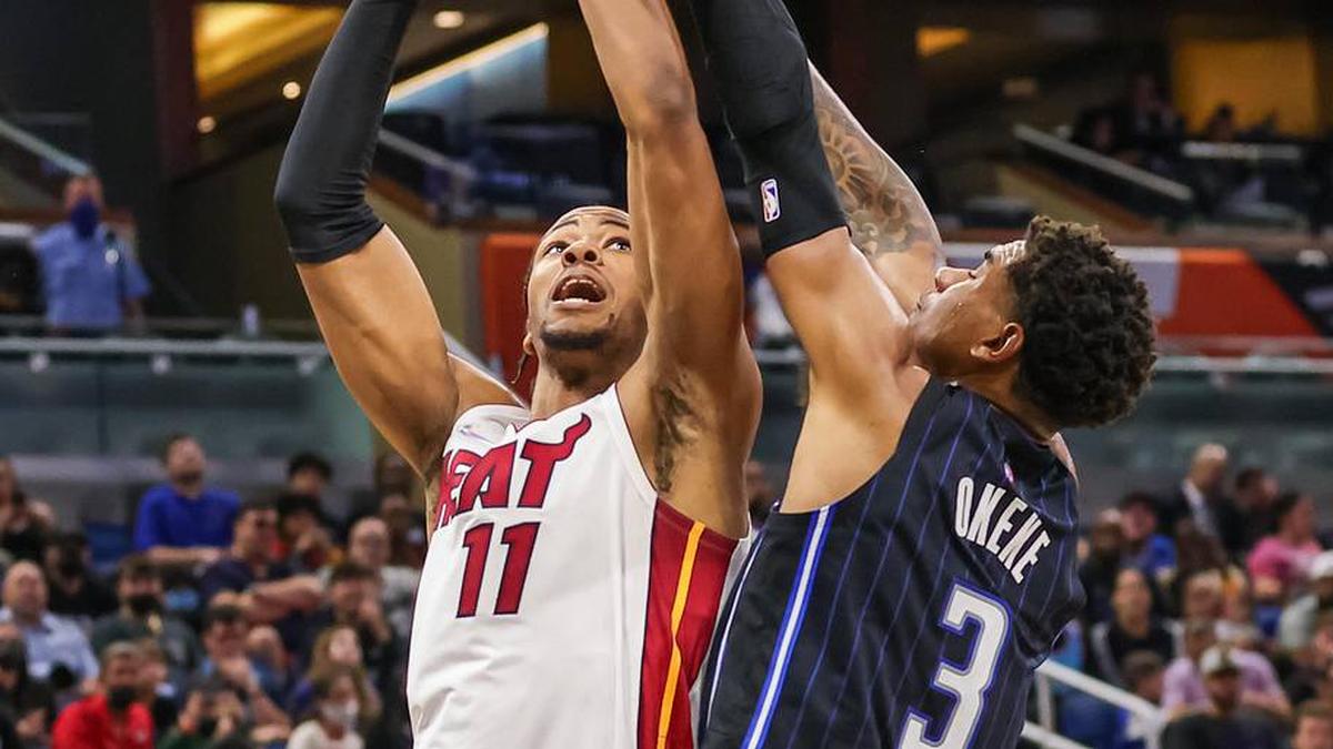  Dec 17, 2021; Orlando, Florida, USA; Miami Heat forward KZ Okpala (11) shoots the ball against Orlando Magic forward Chuma Okeke (3) during the second quarter at Amway Center. Mandatory Credit: Mike Watters-Imagn Images | Mike Watters-Imagn Images 