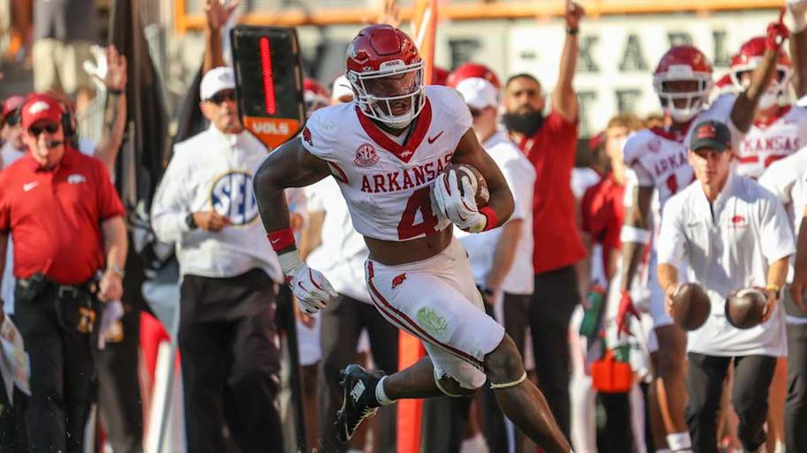  Oct 11, 2025; Knoxville, Tennessee, USA; Arkansas Razorbacks running back Mike Washington (4) runs the ball against the Tennessee Volunteers during the first quarter at Neyland Stadium. Mandatory Credit: Randy Sartin-Imagn Images | Randy Sartin-Imagn Images 