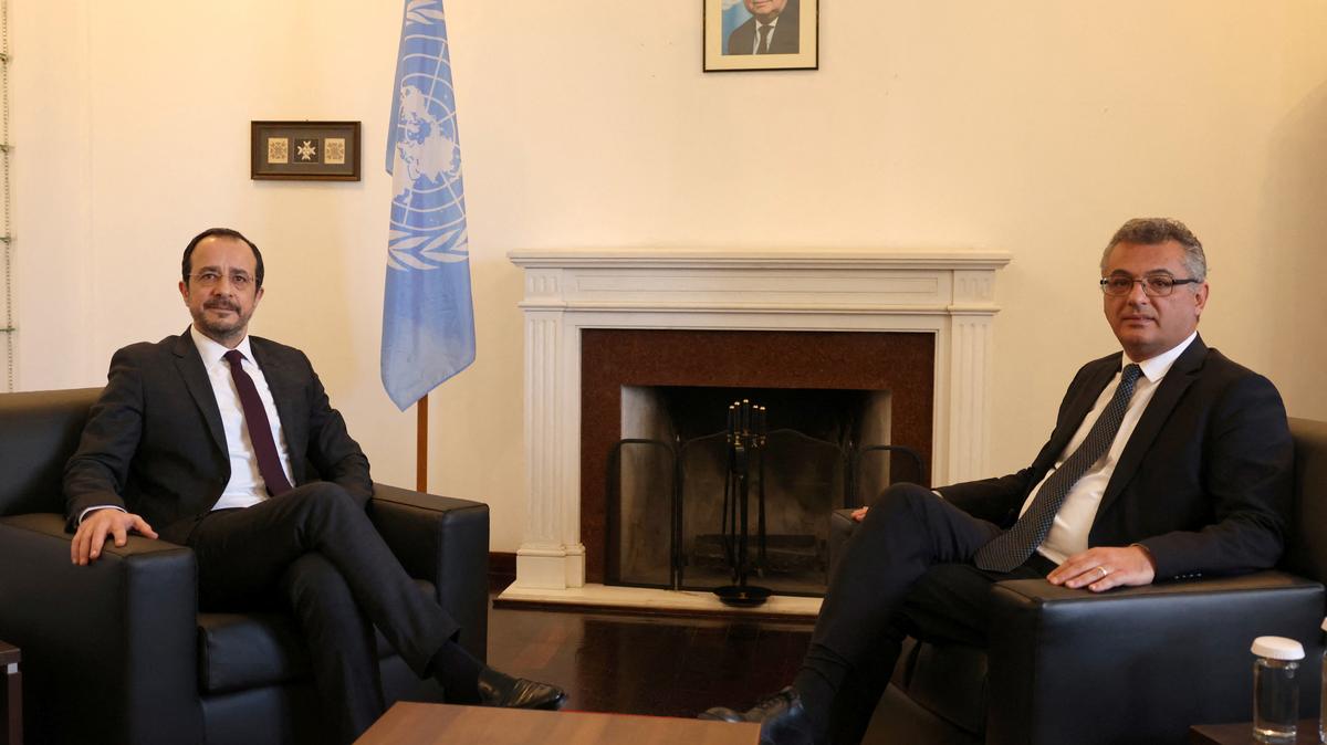 Cyprus President Nikos Christodoulides, who leads Cyprus's Greek Cypriot community, and Turkish Cypriot leader Tufan Erhurman pose for a picture during a meeting in the UN buffer zone of the capital Nicosia, Cyprus February 24, 2026. REUTERS/Yiannis Kourtoglou
