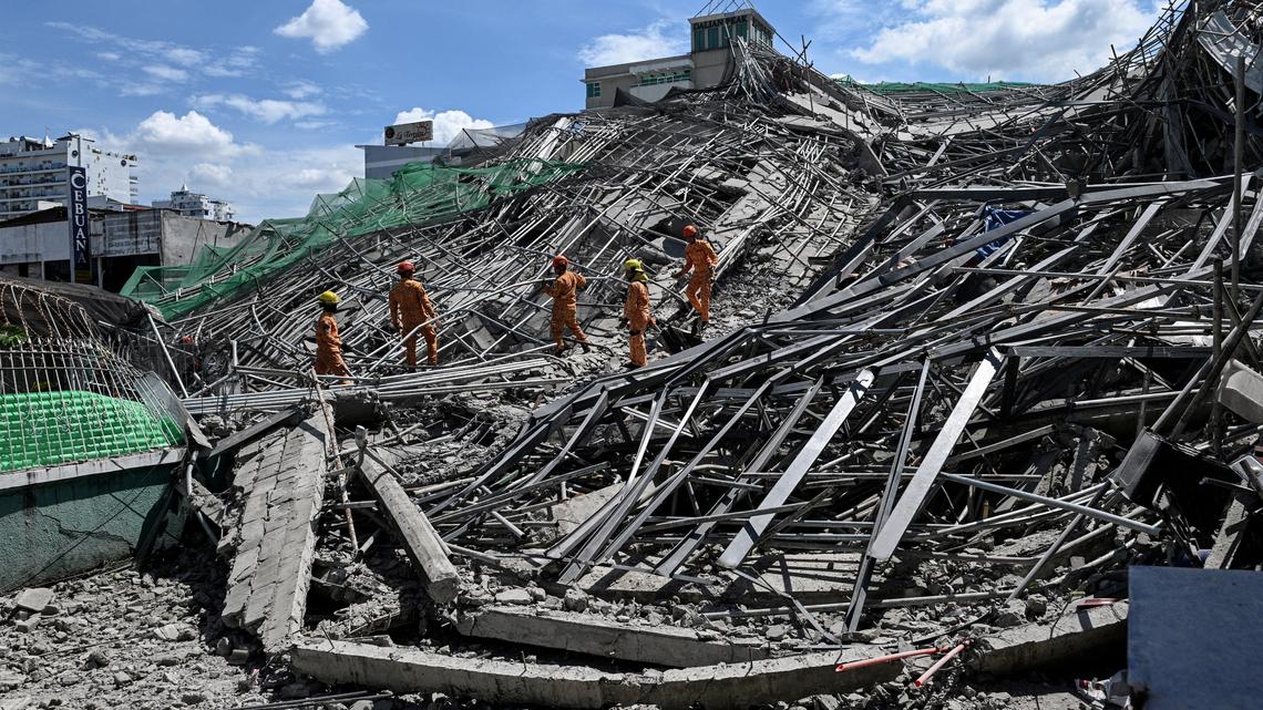 Two trapped people alive after Philippines building collapse, rescue continues 