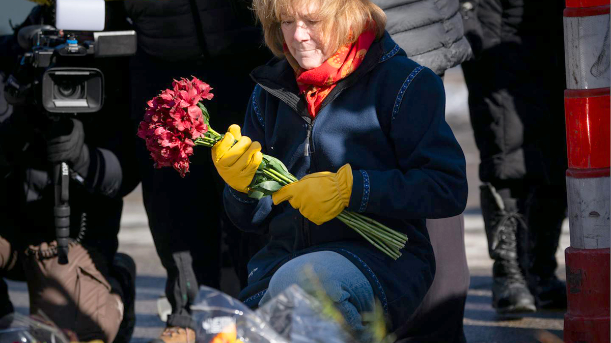 Sen. Tina Smith brings flowers to a large memorial for Alex Pretti on Nicollet Avenue in Minneapolis on Jan. 26. (Renée Jones Schneider/The Minnesota Star Tribune/TNS)