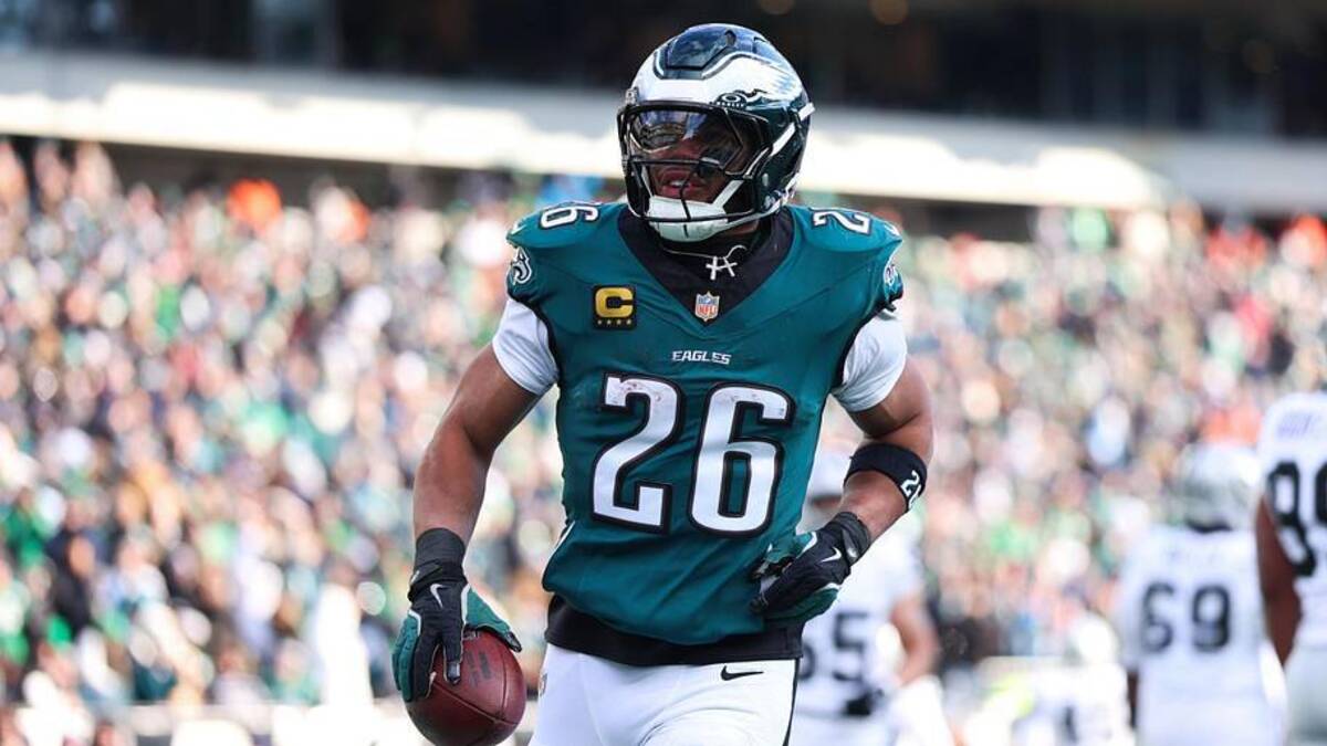  Philadelphia Eagles running back Saquon Barkley (26) reacts after scoring a touchdown against the Las Vegas Raiders during the second quarter at Lincoln Financial Field. | Bill Streicher-Imagn Images 