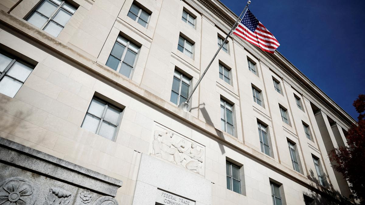 FILE PHOTO: A U.S. flag flutters at the Federal Trade Commission (FTC) headquarters in Washington, D.C., U.S., November 24, 2024. REUTERS/Benoit Tessier/File Photo