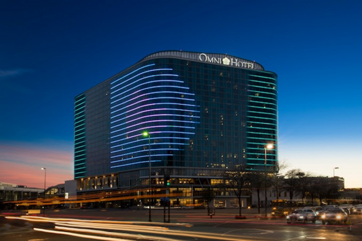 Omni Dallas shines brilliantly against the night sky, blending luxury with the city's skyline. Photo credit: Omni Dallas Hotel