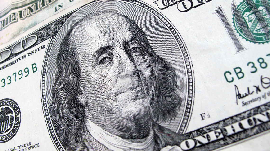 Dollar mixed as traders wait on Fed, Aussie gains