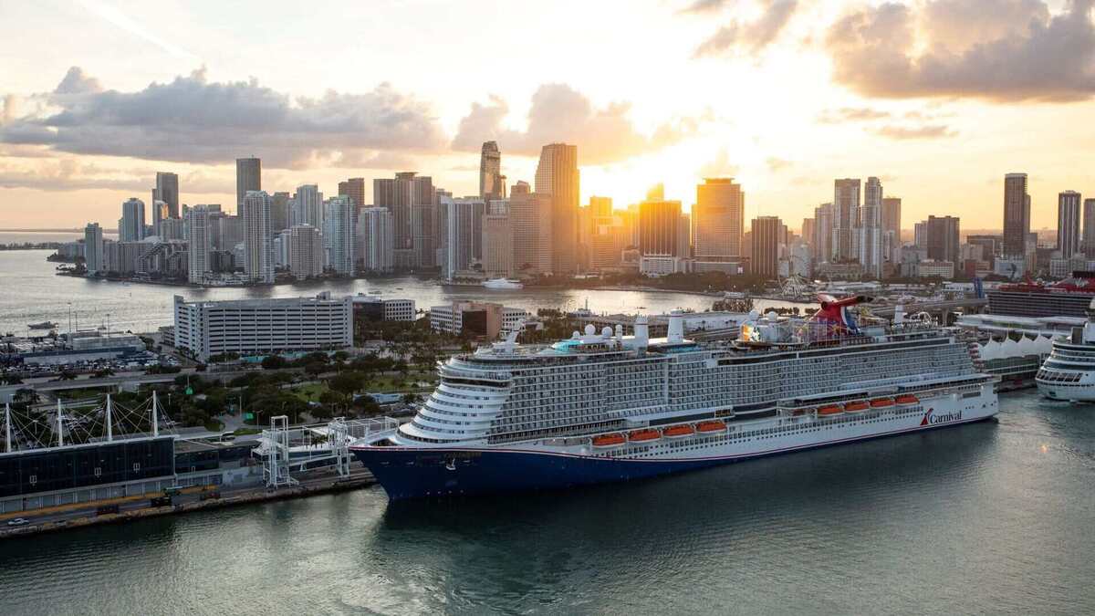 Carnival Celebration cruise ship docked in Miami at sunrise. 