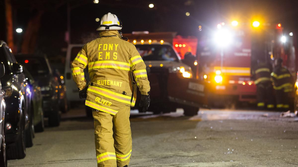 Firefighters leave after putting out a major house fire on Prospect avenue on Dec. 28, 2017, in the Bronx borough of New York City. Over 170 firefighters respond to the evening fire in which at least 12 persons were killed with others injured. (Amir Levy/Getty Images/TNS)