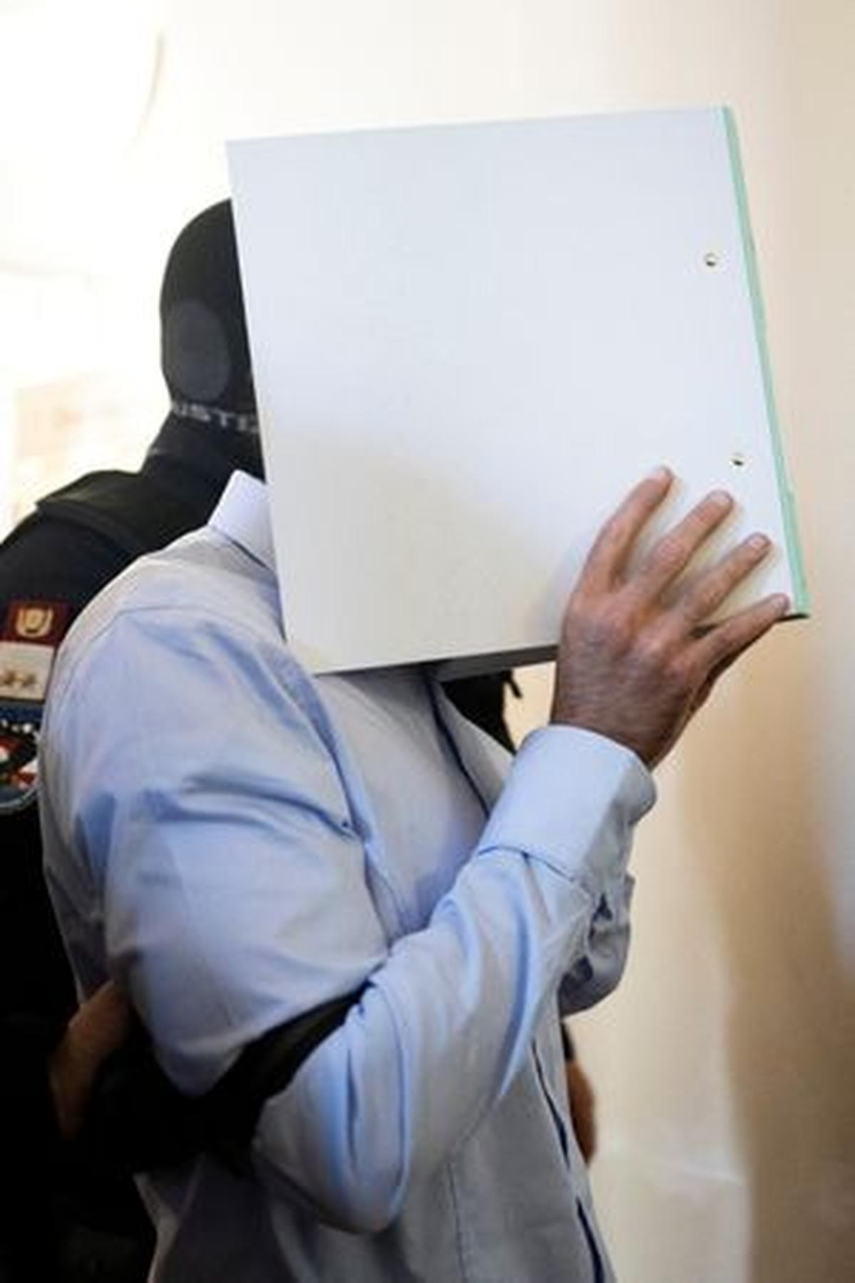 Austrian defendant Beran A, who pleaded guilty to planning an attack on U.S. singer Taylor Swift's Vienna concert in 2024, is escorted by security personnel in a courtroom during the last day of his trial in Wiener Neustadt, Austria, May 28, 2026. REUTERS/Lisa Leutner