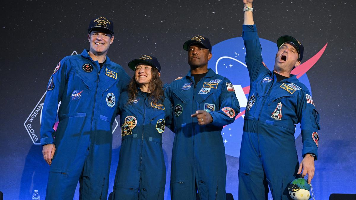 Left to right, NASA's Artemis II mission astronauts Canadian Space Agency's Jeremy Hansen, Christina Koch, Victor Glover and commander Reid Wiseman react during a welcoming ceremony at Ellington Field Joint Reserve Base in Houston, Texas, on April 11, 2026. An elated NASA was celebrating its successful voyage around the Moon, after four astronauts safely returned to Earth having completed the first lunar flyby in more than 50 years. The NASA spacecraft carrying four astronauts -- three Americans and one Canadian -- splashed down without a hitch off the California coast, capping the US space agency's crewed test mission that returned with spectacular images of the Moon. (Ronaldo Schemidt/AFP/Getty Images/TNS)