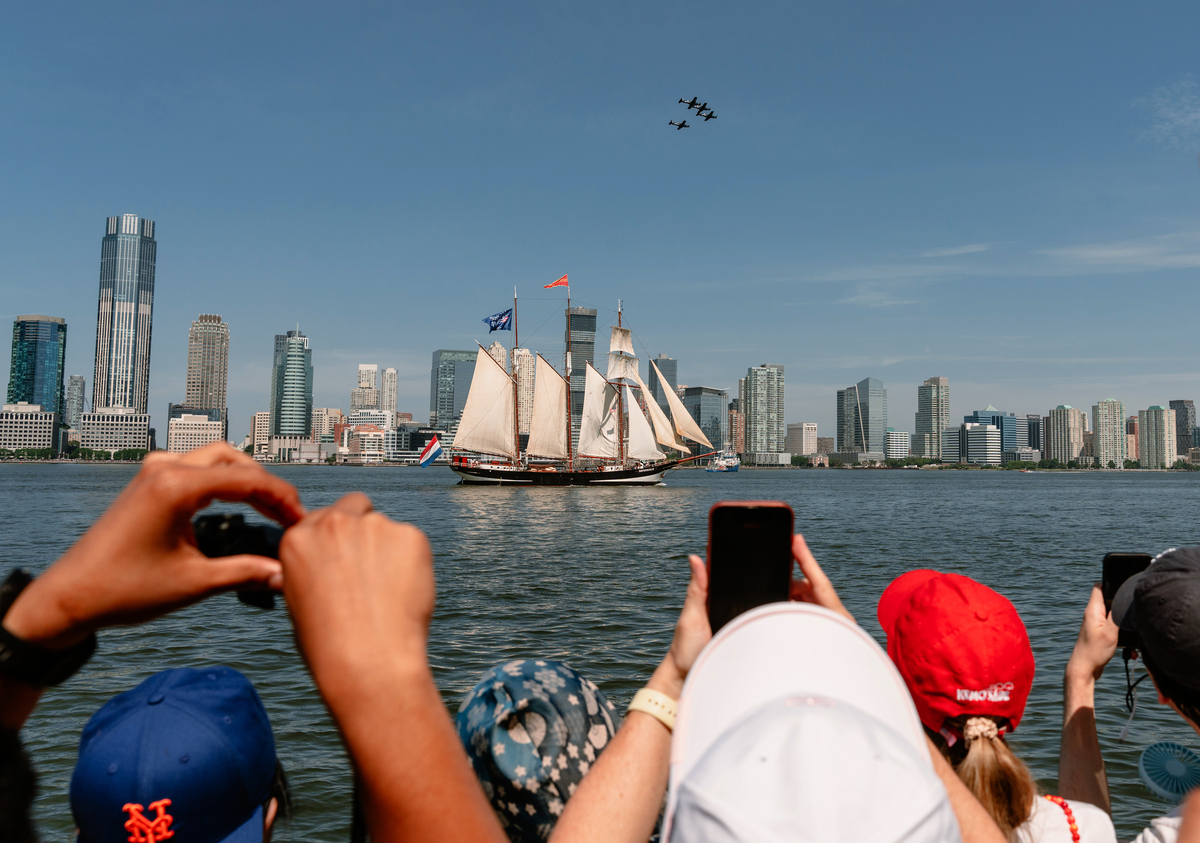 Spectators watch the International Aerial Review from Rockefeller Park in Lower Manhattan during the 250th anniversary of the United States' independence in New York, July 4, 2026. America celebrates the 250th anniversary of its independence today, with people from one end of the country to the other marking the milestone with fireworks, parades and concerts. (Lucia Vazquez/The New York Times)