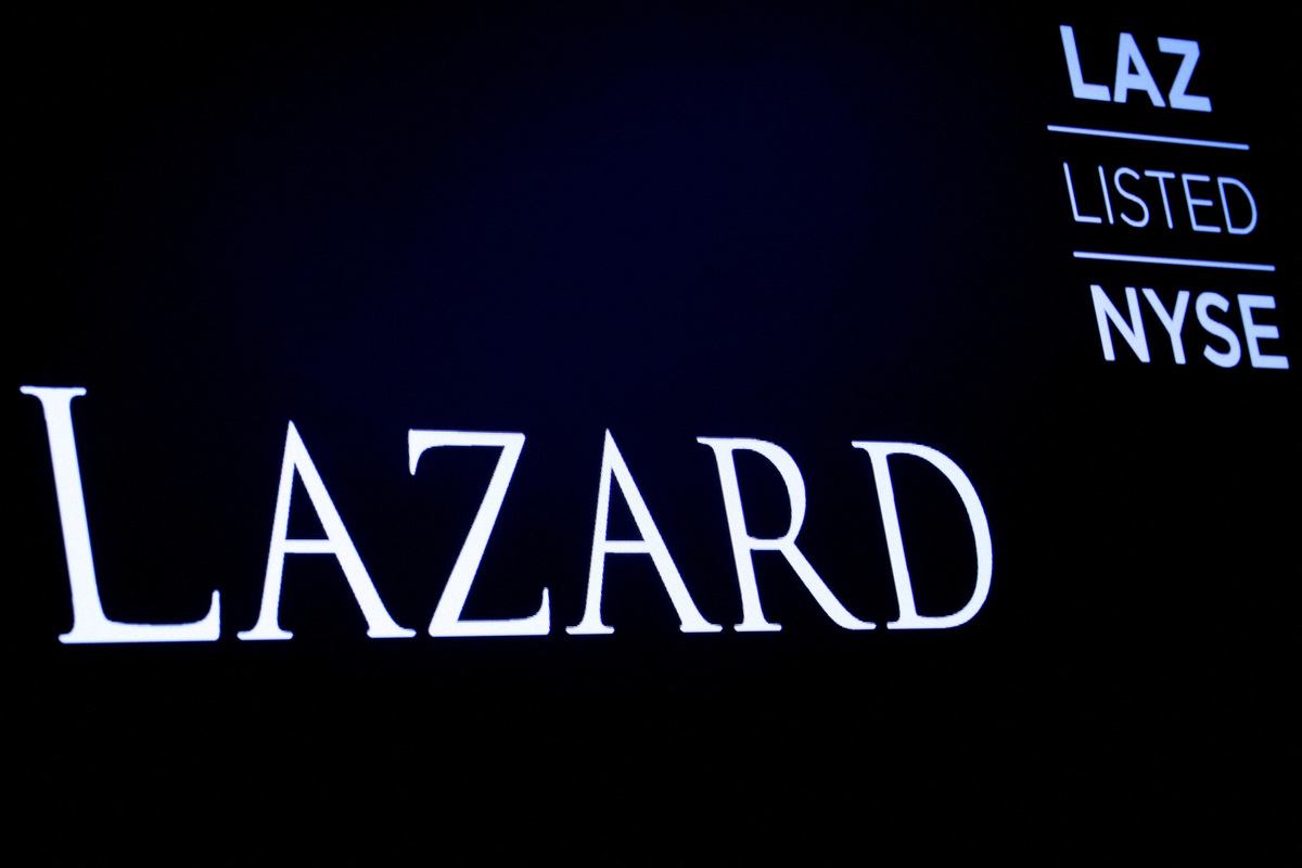 FILE PHOTO: The logo and trading information for Lazard Ltd appear on a screen on the floor at the New York Stock Exchange (NYSE) in New York, U.S., April 24, 2019. REUTERS/Brendan McDermid//File Photo