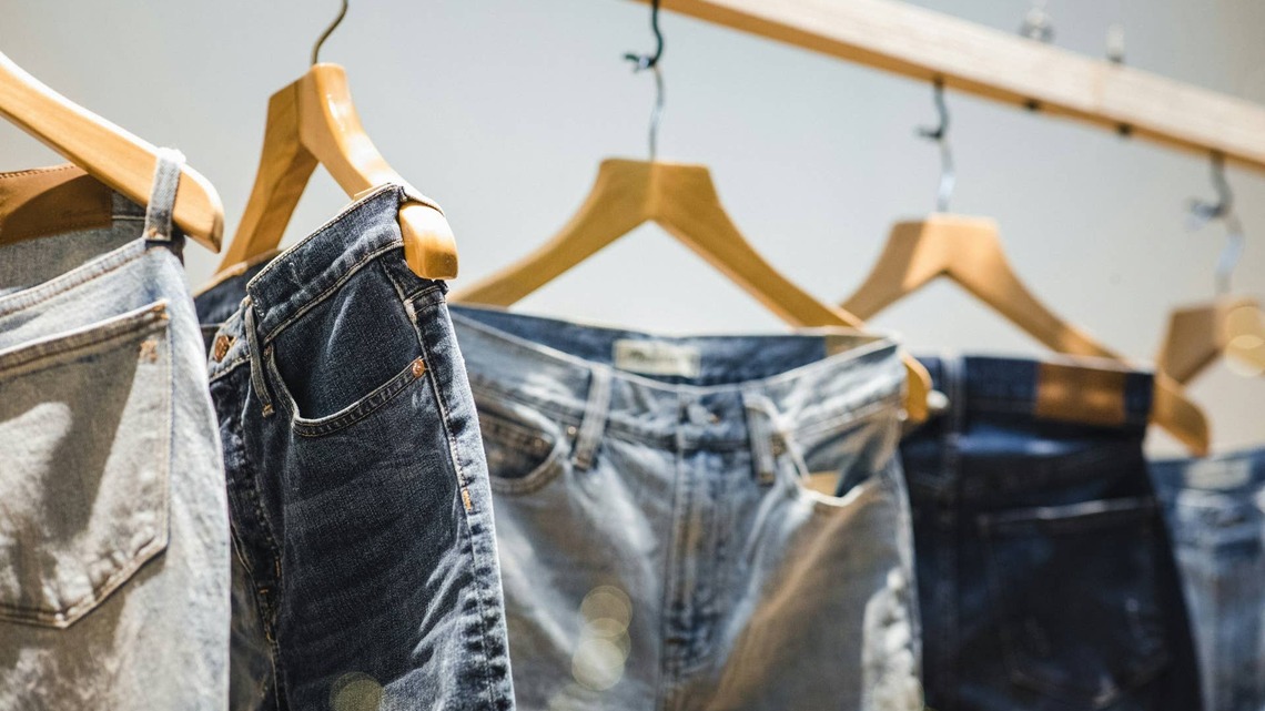 Turn a pair of denim jeans from Goodwill into your next favorite living room decor piece  