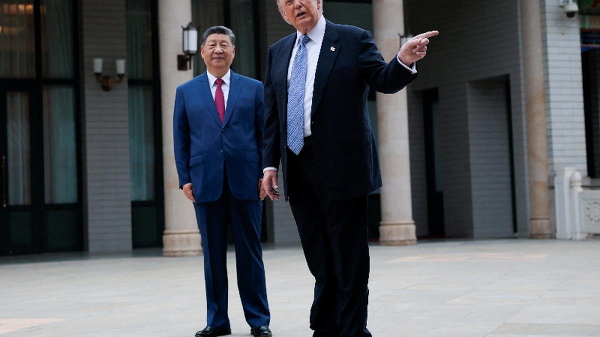 U.S. President Donald Trump gestures as he speaks next to Chinese President Xi Jinping during a visit to the  Zhongnanhai Garden in Beijing, China, May 15, 2026. REUTERS/Evan Vucci/Pool