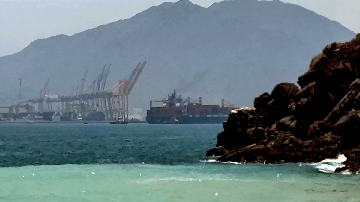 This frame grab taken from AFPTV video footage on July 12, 2026 shows a ship sailing near the Strait of Hormuz off the eastern coast of the United Arab Emirates at Khor Fakkan. Tehran announced it was closing the Strait of Hormuz on July 12 and launched missiles and drones at its Gulf neighbors, in retaliation for new US strikes following an attack by Iranian forces on a merchant vessel that was abandoned in flames by its crew. (AFPTV/AFP/Getty Images/TNS)