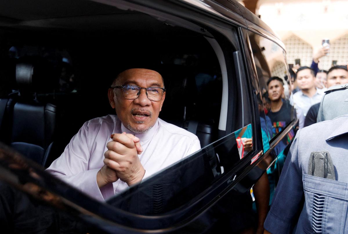 FILE PHOTO: Newly elected Malaysia's Prime Minister Anwar Ibrahim meets supporters during his first public appearance as he attending Friday prayer at a mosque in Putrajaya, Malaysia November 25, 2022. REUTERS/Hasnoor Hussain/File Photo
