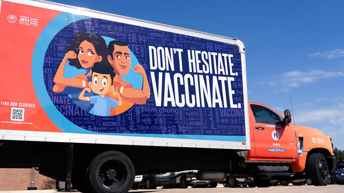 An Austin (Texas) Public Health truck is decorated with an advertisement encouraging vaccinations while parked outside the Austin Public Health office at the Bergstrom Technology Center on Friday. A measles outbreak in the state has sickened more than 150 people and left one child dead as of Monday.
