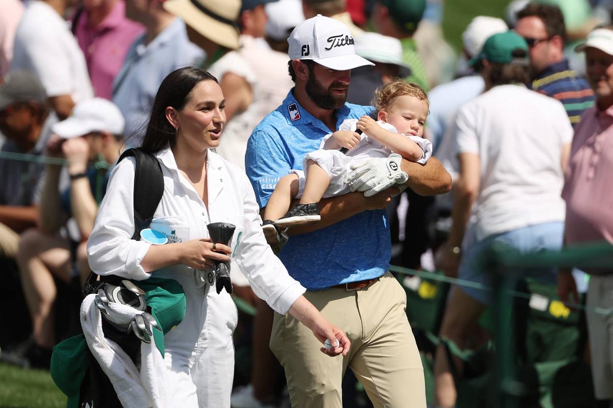  AUGUSTA, GEORGIA - APRIL 05: Cameron Young of the United States looks on with his wife Kelsey, and son Henry during the Par 3 contest prior to the 2023 Masters Tournament at Augusta National Golf Club on April 05, 2023 in Augusta, Georgia. (Photo by Patrick Smith/Getty Images) 