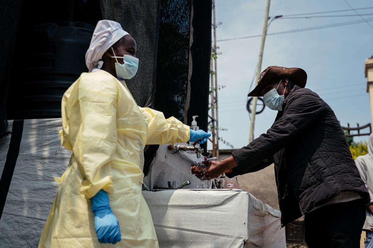  A visitor washes his hands before entering Kyeshero Hospital at a checkpoint for hand-washing and temperature screening for all visitors and patients as part of Ebola prevention measures in Goma on May 18, 2026. (Photo by Jospin Mwisha/AFP via Getty Images) 