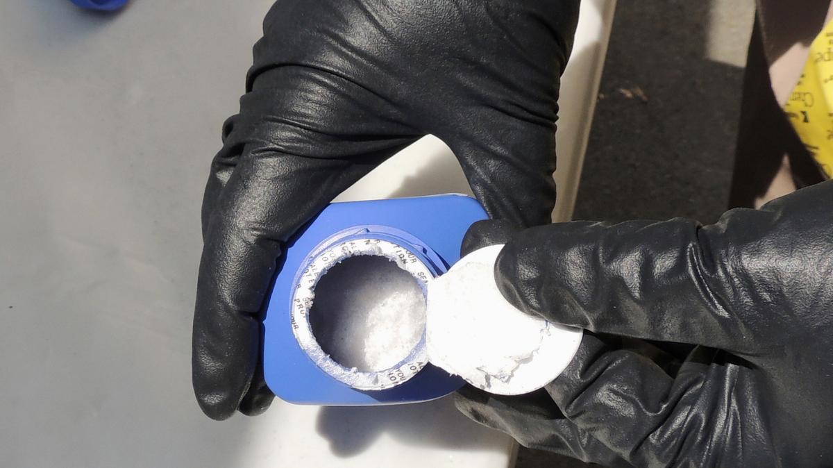 Carfentanil. A 2016 photo provided by the Royal Canadian Mounted Police, a member of the RCMP opens a printer ink bottle containing the opioid carfentanil imported from China, in Vancouver. 