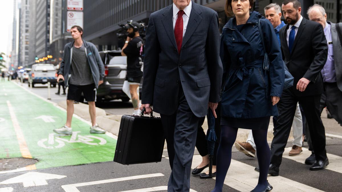 Former Illinois House Speaker Michael Madigan leaves Dirksen U.S. Courthouse after being sentenced to 7 1/2 years in prison and fined $2.5 million during his post-trial sentencing hearing, June 13, 2025, in downtown Chicago. He's trailed by daughter Nicole. (Audrey Richardson/Chicago Tribune/TNS)