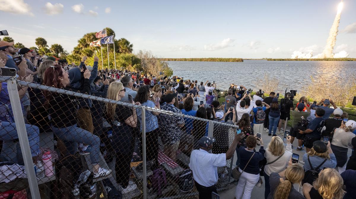 In this handout image provided by NASA, guests watch the launch of the Artemis II mission on April 1, 2026, at NASA's Kennedy Space Center in Cape Canaveral, Florida. (Keegan Barber/NASA via Getty Images/TNS)