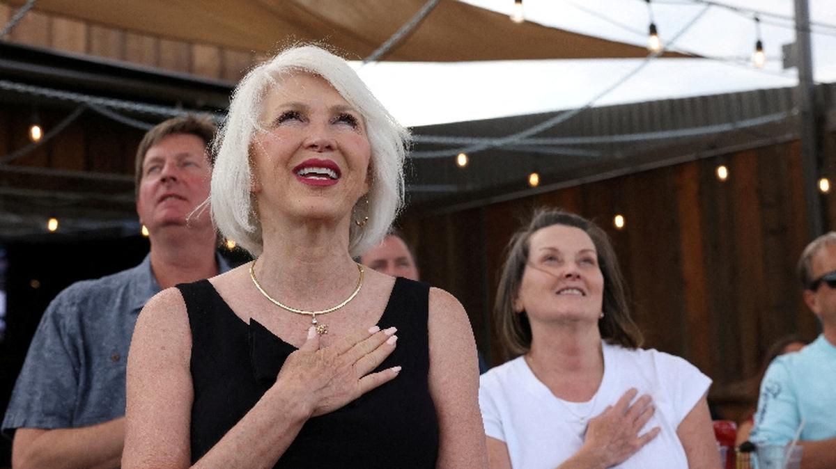 FILE PHOTO: Republican Secretary of State candidate for Colorado, Tina Peters, a county clerk and election denier who's been indicted on criminal charges for tampering with voting machines, sings the National Anthem at her primary election night rally in Sedalia, Colorado, U.S., June 28, 2022.  REUTERS/Kevin Mohatt/File Photo
