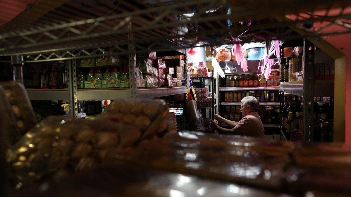 FILE PHOTO: A person works at a grocery store inside Mercado Central, a marketplace of about 35 Latino‑owned small businesses in Minneapolis, Minnesota, U.S., February 12, 2026.  REUTERS/Go Nakamura/File Photo