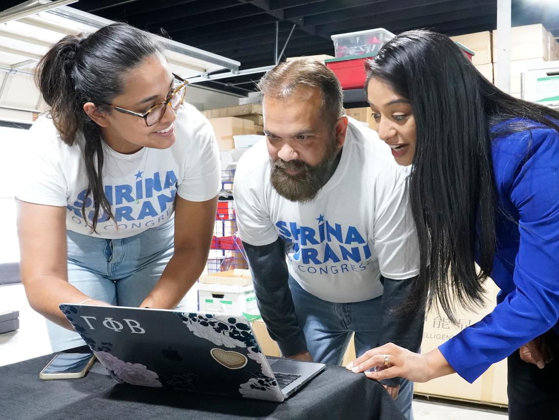 Shrina Kurani, a Democratic candidate for Congress running in California’s 41st District, right, talks to campaign volunteers, Field Director Rasneek Singh, left, and Michael Ramlogan at her field office on Saturday, May 28, 2022.